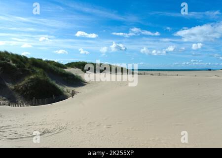 Barmouth beach, Cardigan bay, Wales. Seascape with broad sandy strand with dunes. British summer seaside scene.  Landscape aspect with copy space. Stock Photo