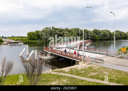Kolomna, Russia - June 11, 2022: folding Bobrenevsky pedestrian pontoon bridge on Moskva River in Kolomna city on sunny summer day Stock Photo