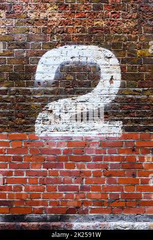 The number two painted in white on a distressed brick wall Stock Photo