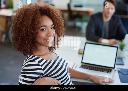 Developing tomorrows tech today. a designer at their workstation in an office. Stock Photo