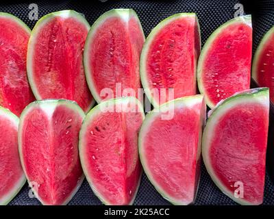 Fresh sliced watermelon in the market. Front view. Stock Photo