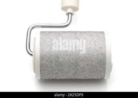 close up of used sticky roller cleaning, housework and housekeeping concept Stock Photo