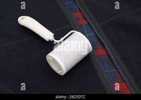 close up of used sticky roller cleaning, housework and housekeeping concept Stock Photo