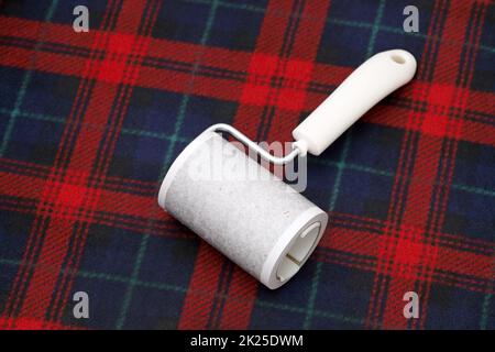 close up of used sticky roller cleaning, housework and housekeeping concept Stock Photo