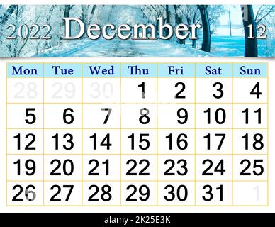 calendar for December 2022 with picture of winter road covered with hoarfrost Stock Photo