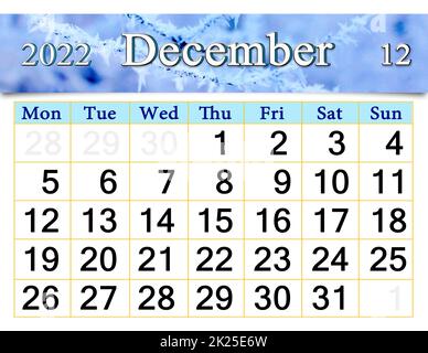 calendar for December 2022 with picture of tree branch covered with frost Stock Photo