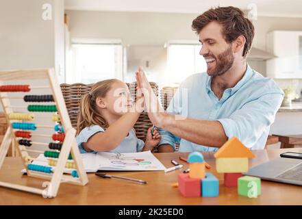 Education, learning and high five by father and girl in homeschooling lesson at kitchen table. Support, teaching and help in child development by Stock Photo