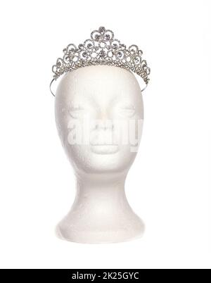 Jeweled Tiara on Mannequin Head Isolated on White Stock Photo