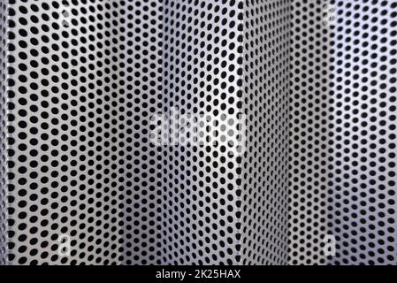 Metal wall with holes Stock Photo