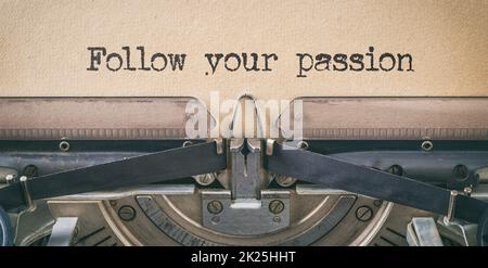 Text written with a vintage typewriter - Follow your passion Stock Photo