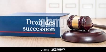 Law book with a gavel - Law of succession in french - Droit des succession Stock Photo
