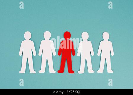 Group of people, one person is standing out from the crowd, concept leadership, manager of team, paper cut out Stock Photo