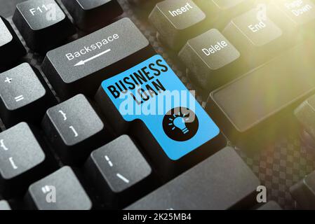 Text sign showing Business Loan. Internet Concept Credit Mortgage Financial Assistance Cash Advances Debt Compiling And Typing Online Research Materials, Sending Chat Messages Stock Photo