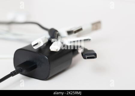 EU proposes standardization of charging cables for cell phones according to the USB-C standard, Saving and avoiding waste through standardization. Stock Photo