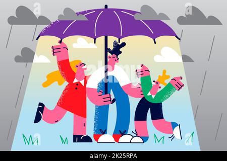 Happy family with child stand under umbrella Stock Photo