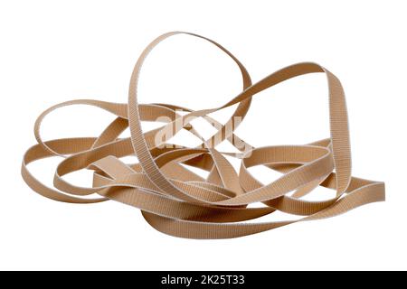 Roller shutter belt isolated. Close-up of a beige hard-wearing and tear-resistant, sturdy webbing for roller shutters and blinds isolated on a white background. Stock Photo