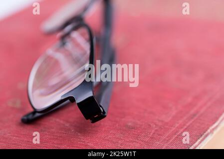 glasses on a old book Stock Photo