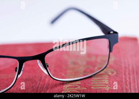 glasses on a old book Stock Photo