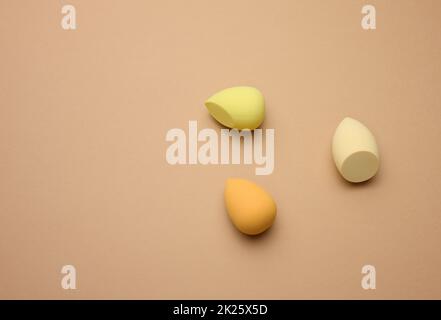oval new egg-shaped sponges for cosmetics and foundation, top view Stock Photo