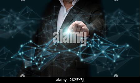 A businessman in a suit stands against the background of a hologram and holds a bunch of keys in his hand. Sale and rental of cars, purchase of real estate, mortgage Stock Photo