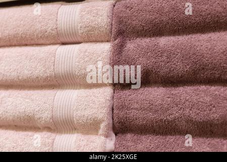 Stack of fluffy towels in store. Background Stock Photo
