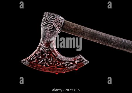 Medieval ax in red blood isolated on black background with clipping path Stock Photo