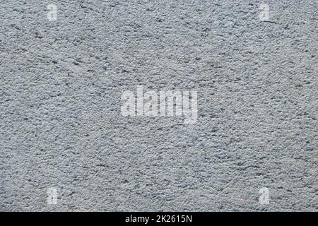 Part of the rough gray rough surface of the stone. Stock Photo