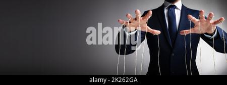 Close-up Of Man Controls The Puppet With Fingers Stock Photo