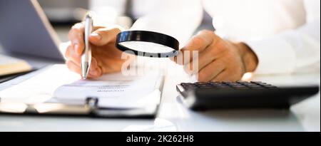 Fraud Investigation And Tax Audit. Investigator Or Auditor Stock Photo