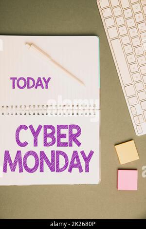 Text sign showing Cyber Monday. Conceptual photo Marketing term for Monday after thanksgiving holiday in the US Keyboard Over A Table Beside A Notebook And Pens With Sticky Notes Stock Photo
