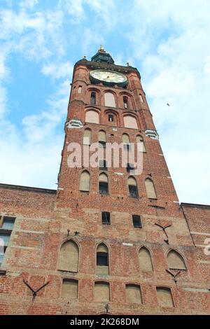 Antique red brick tower with wall clock in Gdansk. architecture of city building Stock Photo