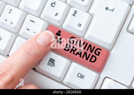 Text sign showing Giving Brand. Business approach The process of giving a Name to a company products or services Retyping Download History Files, Typing Online Registration Forms Stock Photo