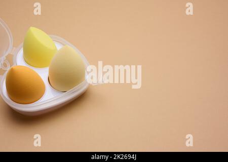 oval new egg-shaped sponges for cosmetics and foundation, top view Stock Photo