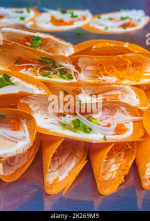 Thai pancake sweet China Town street food market Bangkok Thailand. Stock Photo