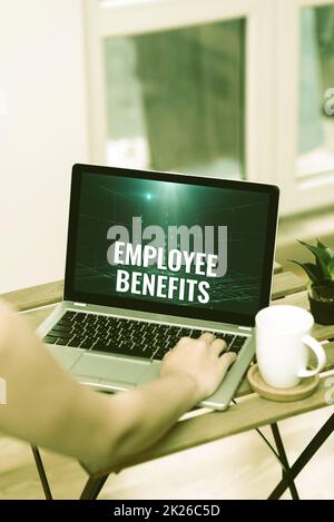 Conceptual caption Employee Benefits. Word Written on form of compensation paid by employers to workers Hand Busy Typing On Laptop Beside Coffe Mug And Plant Working From Home. Stock Photo