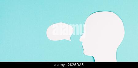 Silhouette of a face, speech bubble in white color, copy space for text, communication, having an opinion, free speech Stock Photo