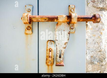 Old rusty lock on a wooden door Stock Photo