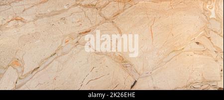 Polished natural beige marble tile with natural streaks. Stock Photo