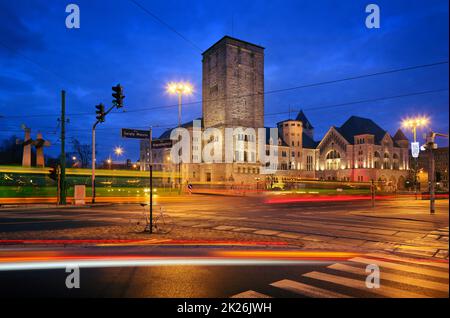 Poznan, Poland - imperial castle, prussian architecture and tram by night Stock Photo