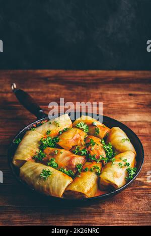 Cabbage Rolls Stuffed with Minced Pork in Frying Pan Stock Photo