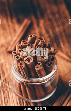 Cinnamon sticks in a glass jar Stock Photo