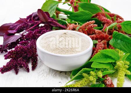 Flour amaranth in bowl on board Stock Photo
