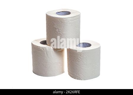 Three rolls of toilet paper stand in a pyramid on a white isolated background Stock Photo