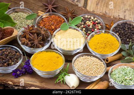 Variety of spices on wooden background Stock Photo