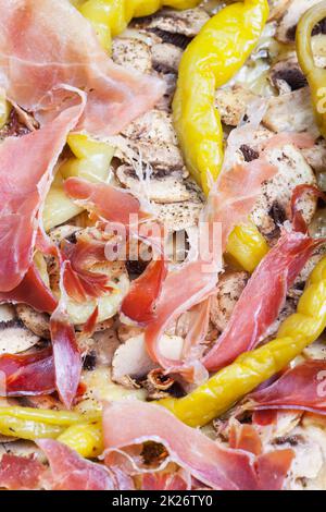 detail of a pizza with ham Stock Photo