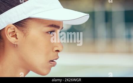 Sports, fitness and woman on a tennis court ready to play a professional competitive game or match in summer. Portrait of a serious girl athlete Stock Photo