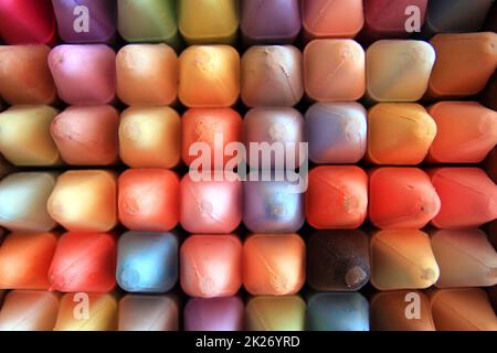 Close up of a set of colored crayons with a square shape and round tip Stock Photo