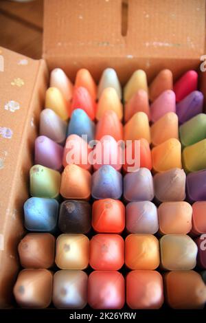 A box of colored crayons not yet touched by babies Stock Photo