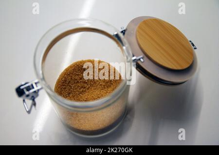 Close up of a isolated glass and wood cane sugar jar Stock Photo