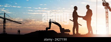 Architects Shaking Hands Outdoors Stock Photo
